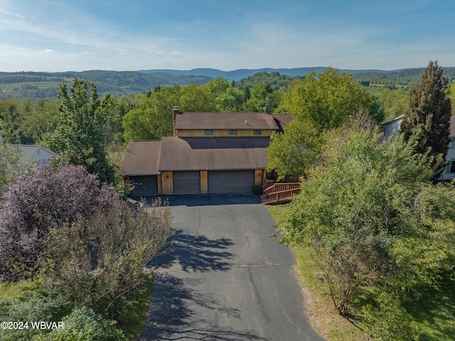 birds eye view of property featuring a mountain view