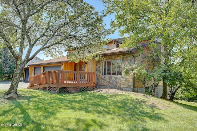 rear view of house featuring a deck and a lawn