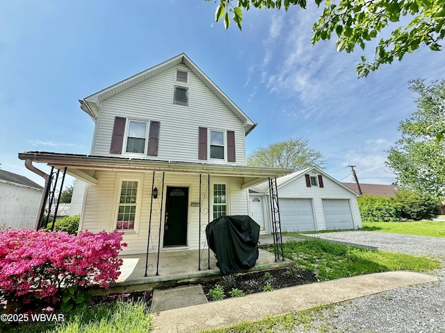 117 Kendall Ave, Jersey Shore, PA 17740 - view of front of house with covered porch, an outdoor structure, and a garage