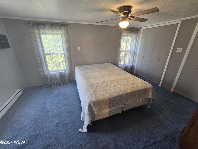 117 Kendall Ave, Jersey Shore, PA 17740 - carpeted bedroom featuring multiple windows, a baseboard heating unit, ornamental molding, and a ceiling fan