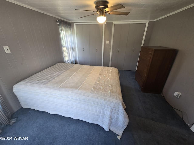 117 Kendall Ave, Jersey Shore, PA 17740 - bedroom featuring dark carpet, two closets, ornamental molding, and ceiling fan