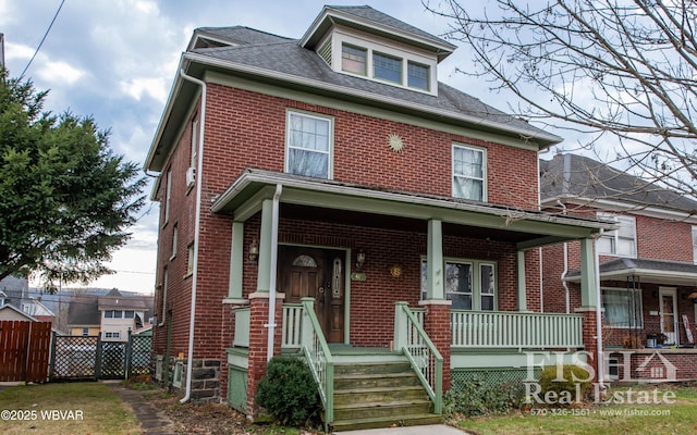 view of front of property featuring covered porch