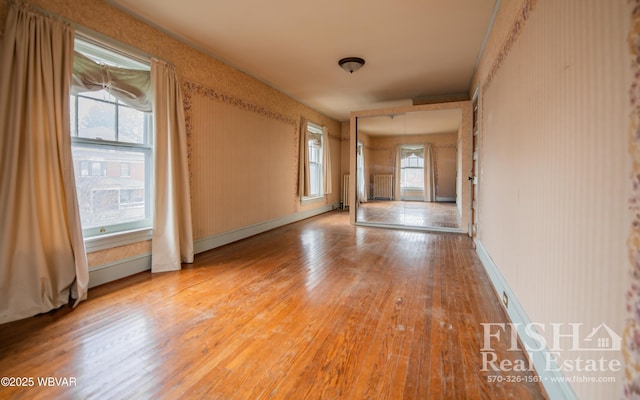 spare room with hardwood / wood-style floors