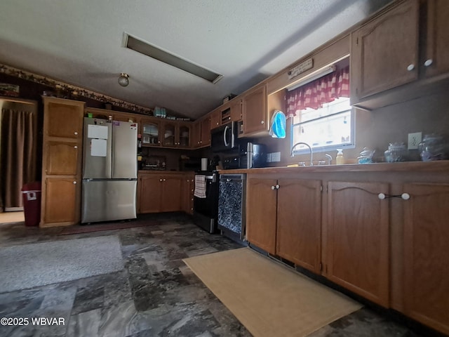 442 Mcelhattan Dr, Lock Haven, PA 17745 - kitchen featuring freestanding refrigerator, range, vaulted ceiling, glass insert cabinets, and dishwasher