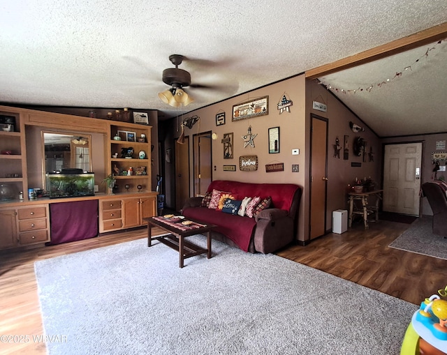 442 Mcelhattan Dr, Lock Haven, PA 17745 - living area featuring wood finished floors, a textured ceiling, a ceiling fan, and vaulted ceiling