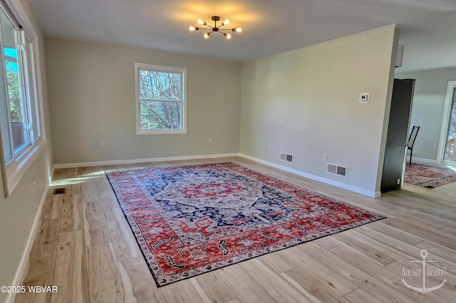 77 Yost Rd, Mill Hall, PA 17751 - interior space with visible vents, light wood-type flooring, and an inviting chandelier