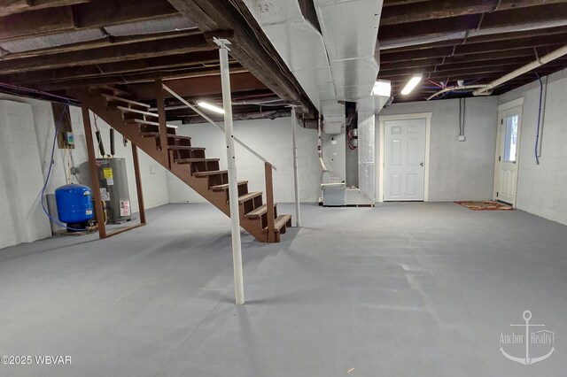 77 Yost Rd, Mill Hall, PA 17751 - below grade area with electric water heater, heating unit, and stairs