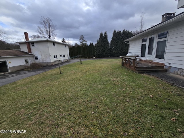 view of yard with a deck