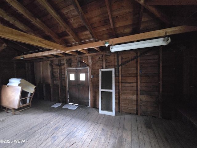 misc room featuring wooden ceiling, hardwood / wood-style floors, and lofted ceiling with beams