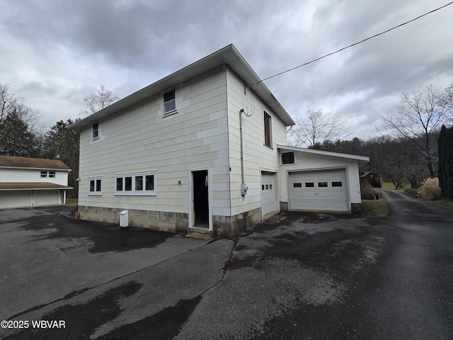 view of property exterior with driveway