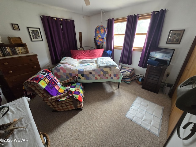 bedroom with ceiling fan and carpet flooring