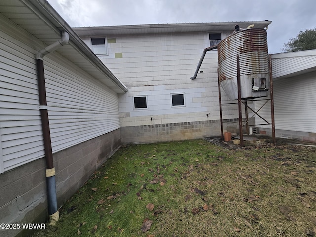 view of home's exterior featuring a yard