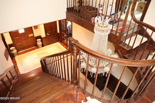 stairway with hardwood / wood-style flooring