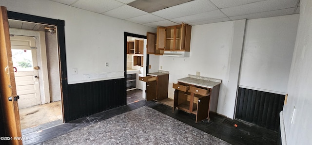 kitchen featuring a paneled ceiling and radiator