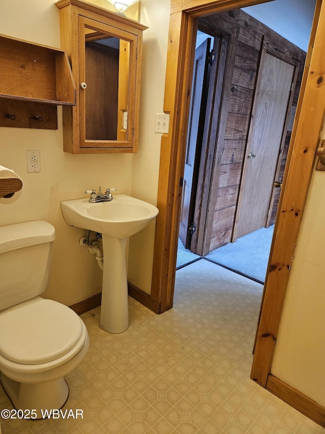 bathroom with toilet and sink