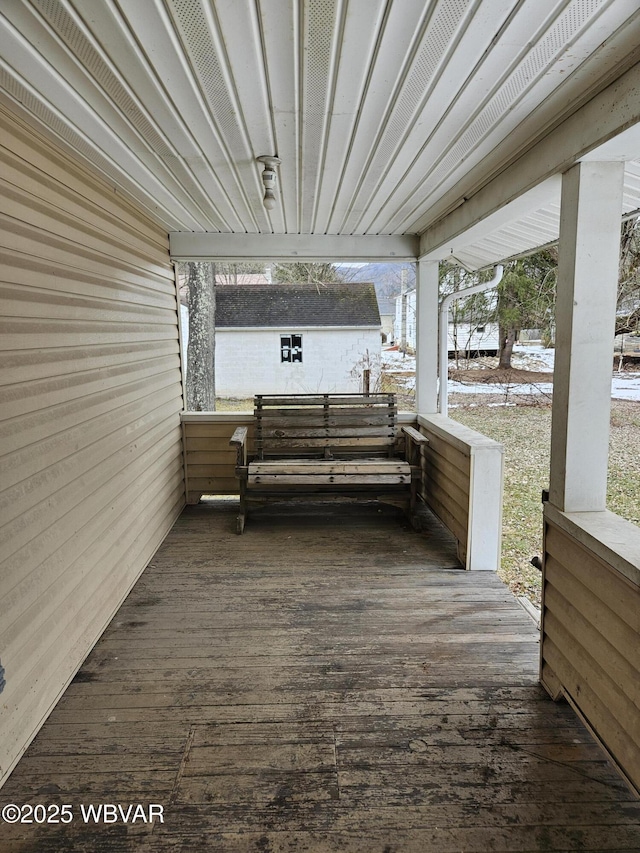 wooden deck featuring an outdoor structure