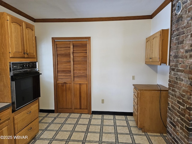 kitchen featuring black oven, brick wall, and ornamental molding