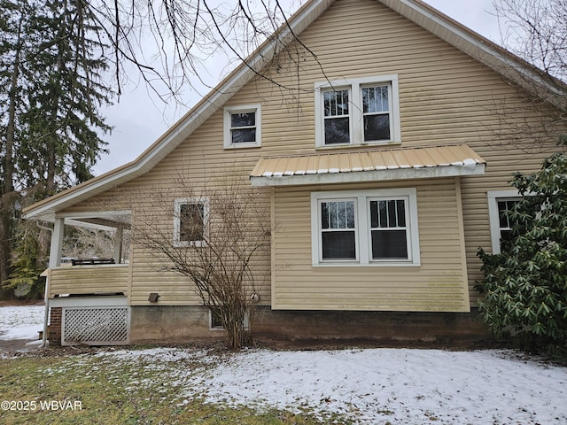 view of snow covered house