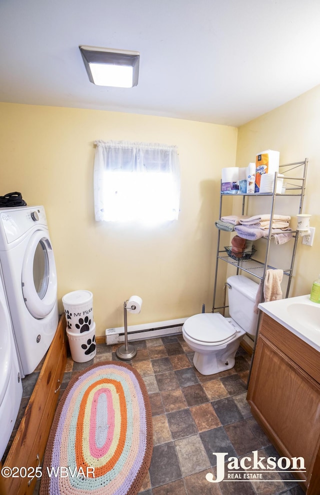 232 Nelson St, Jersey Shore, PA 17740 - half bath featuring toilet, vanity, baseboard heating, stone finish floors, and washing machine and clothes dryer
