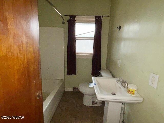 full bathroom with a sink and toilet