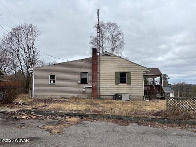 view of side of property with a chimney