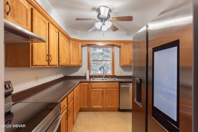 kitchen featuring ceiling fan, stainless steel appliances, crown molding, and sink