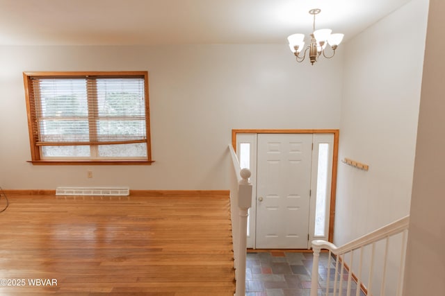 entrance foyer with a chandelier