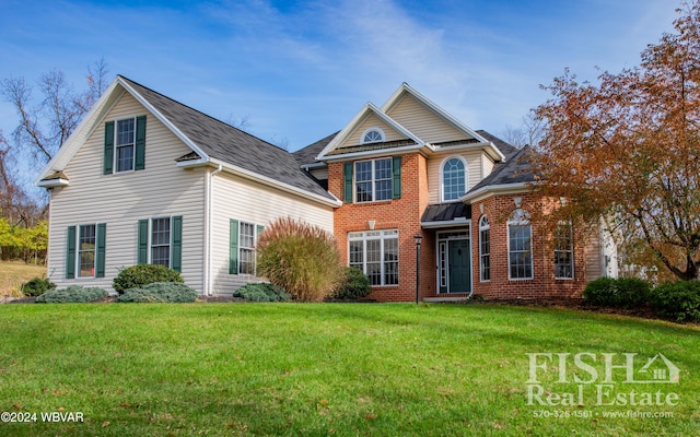 view of front property with a front lawn