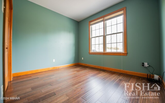 empty room featuring hardwood / wood-style flooring