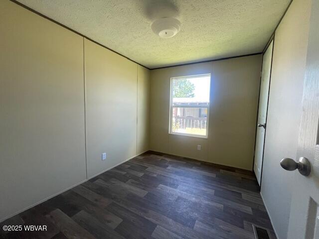14 Albatross Dr, Watsontown, PA 17777 - unfurnished room with a textured ceiling and wood finished floors