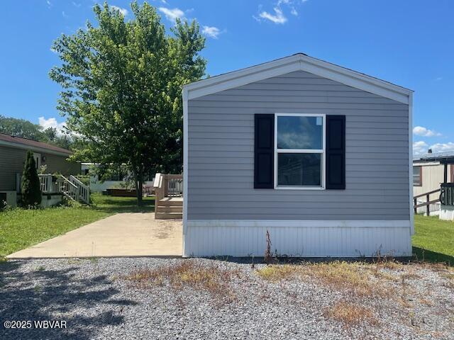 14 Albatross Dr, Watsontown, PA 17777 - view of property exterior featuring a patio and a wooden deck