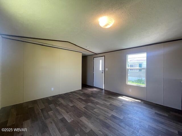 14 Albatross Dr, Watsontown, PA 17777 - unfurnished room featuring dark wood finished floors and a textured ceiling
