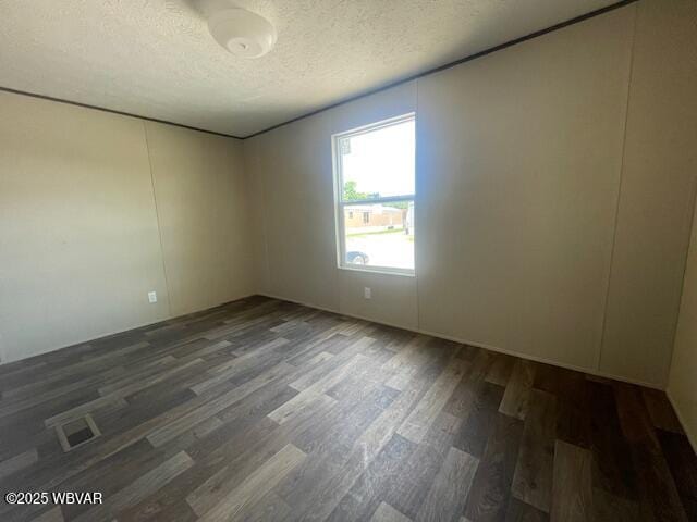 14 Albatross Dr, Watsontown, PA 17777 - unfurnished room with wood finished floors and a textured ceiling