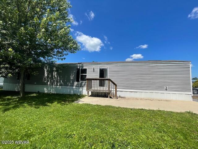 14 Albatross Dr, Watsontown, PA 17777 - rear view of house featuring a yard