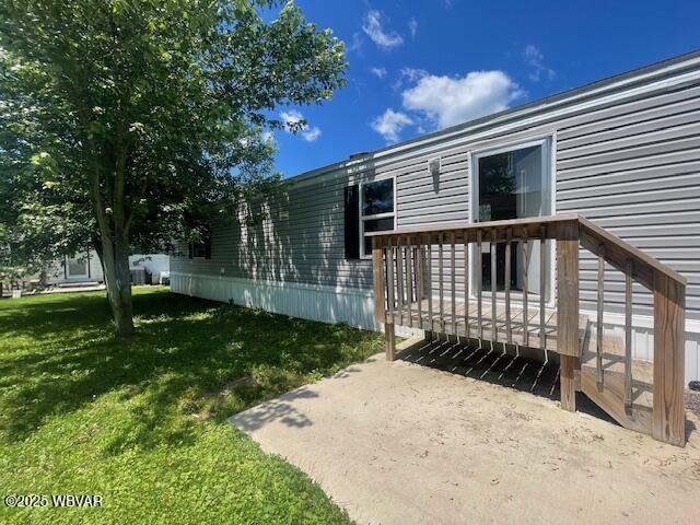 14 Albatross Dr, Watsontown, PA 17777 - view of green lawn with a wooden deck