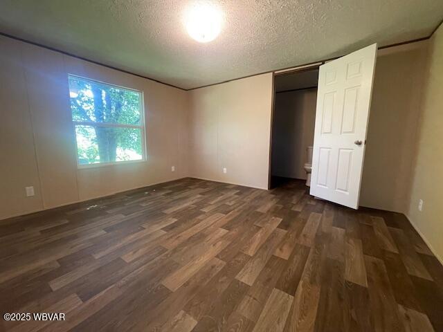 14 Albatross Dr, Watsontown, PA 17777 - unfurnished bedroom featuring a textured ceiling and wood finished floors