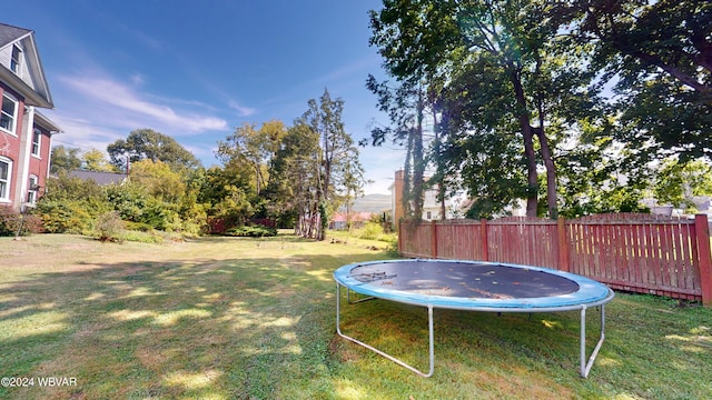 view of yard with a trampoline