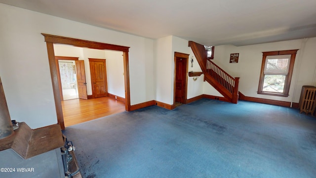 interior space featuring dark hardwood / wood-style flooring and radiator