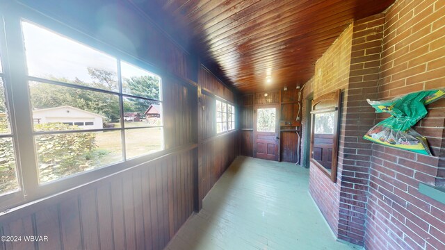 hall with brick wall and wood walls