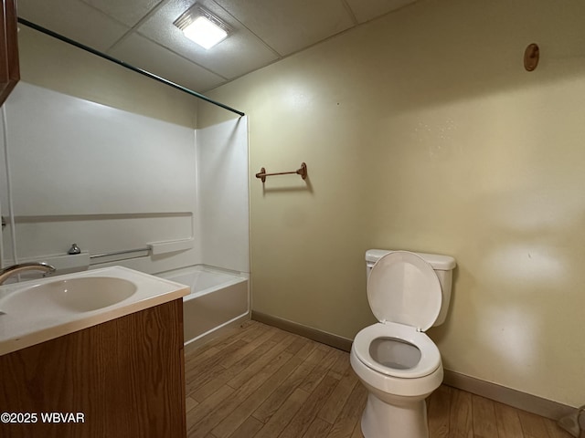 325 Washington Ave, Jersey Shore, PA 17740 - full bathroom with a paneled ceiling, baseboards, toilet, and wood finished floors