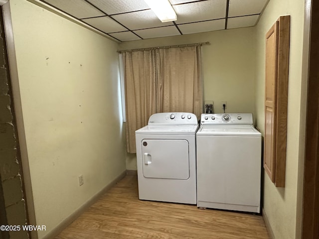 325 Washington Ave, Jersey Shore, PA 17740 - laundry room featuring washing machine and clothes dryer, light wood finished floors, and baseboards
