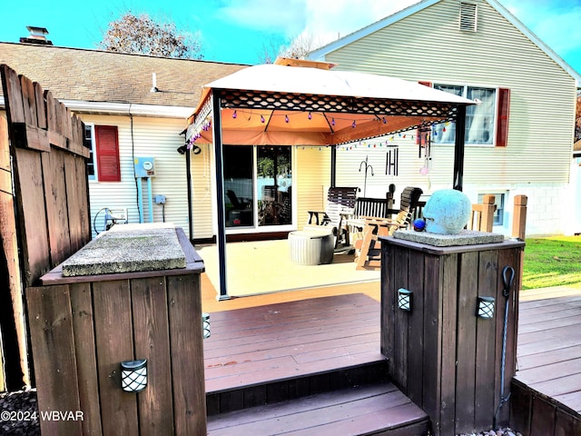 wooden deck featuring a gazebo