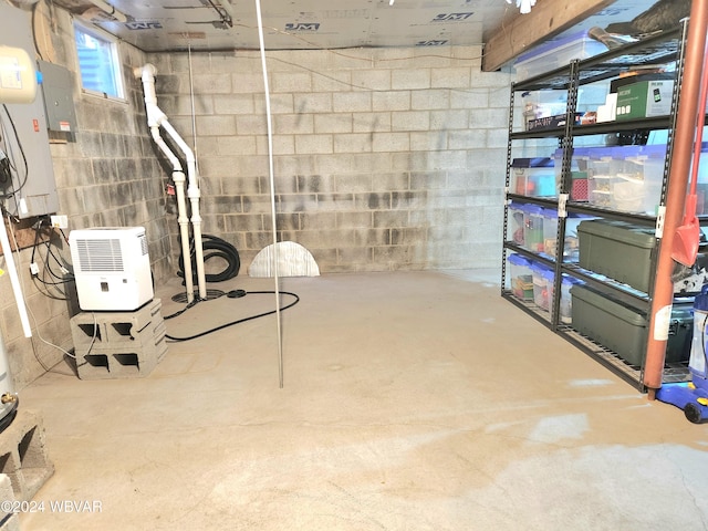 interior space with concrete block wall