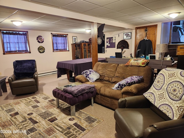 carpeted living room featuring a paneled ceiling and baseboard heating