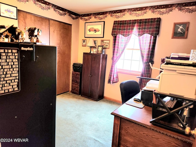 carpeted office featuring baseboards