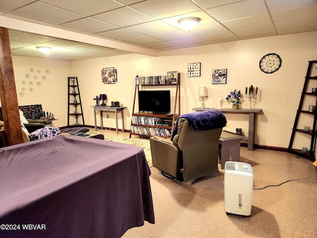 playroom with baseboards and a drop ceiling