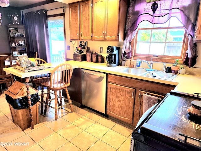 kitchen featuring light countertops, brown cabinetry, a sink, dishwasher, and black / electric stove