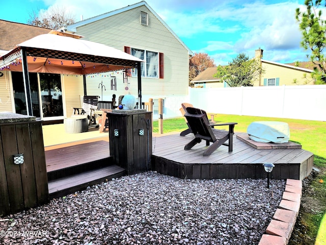 wooden deck with fence and a gazebo