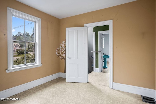 152 Carpenter St, Dushore, PA 18614 - unfurnished bedroom featuring multiple windows and tile patterned floors