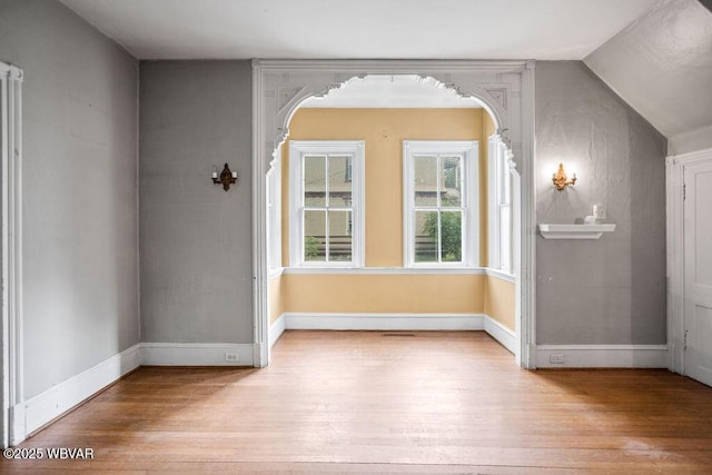 152 Carpenter St, Dushore, PA 18614 - bonus room featuring hardwood / wood-style floors, lofted ceiling, and arched walkways